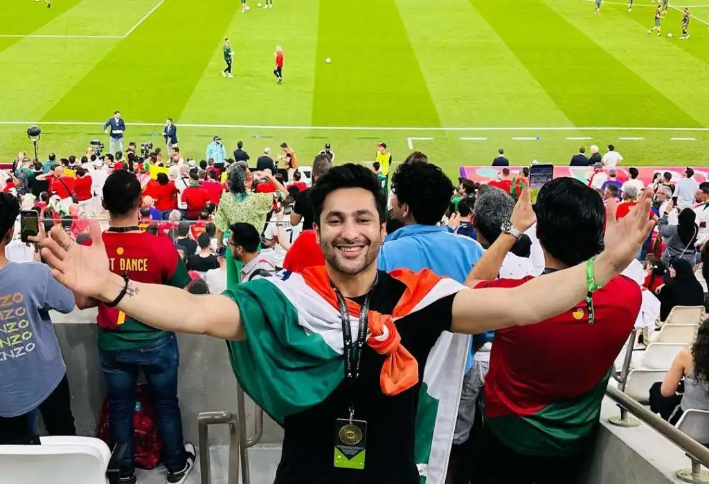 Harsh Beniwal at the final of FIFA world Cup Final wearing the flag of India