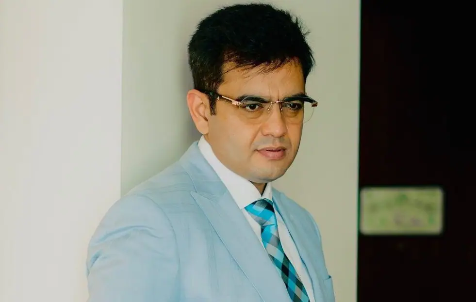 Sonu Sharma in a blue three piece suit