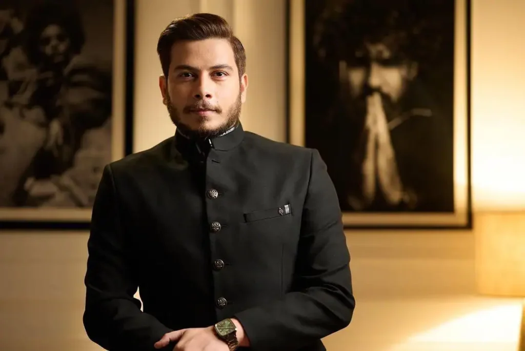 Nitish Rajput wearing a black coat